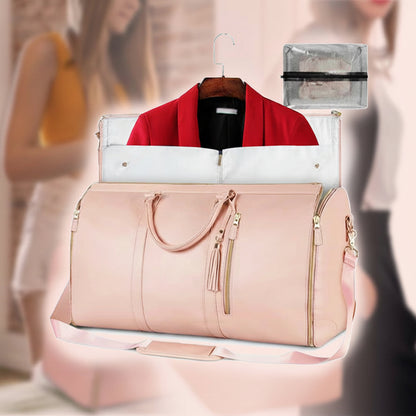 Pink travel bag with a red jacket and black shirt on a blurred background